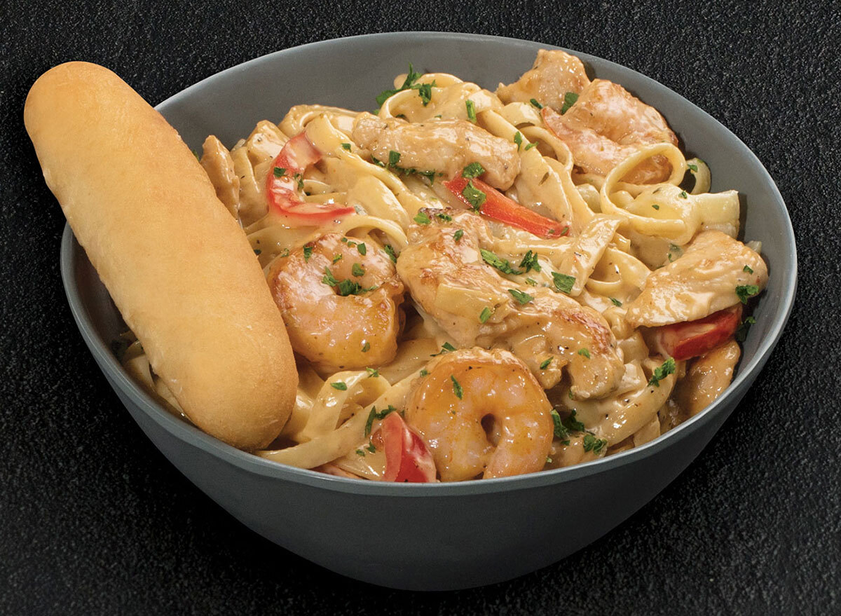 tgi fridays cajun shrimp and chicken pasta bowl on black background