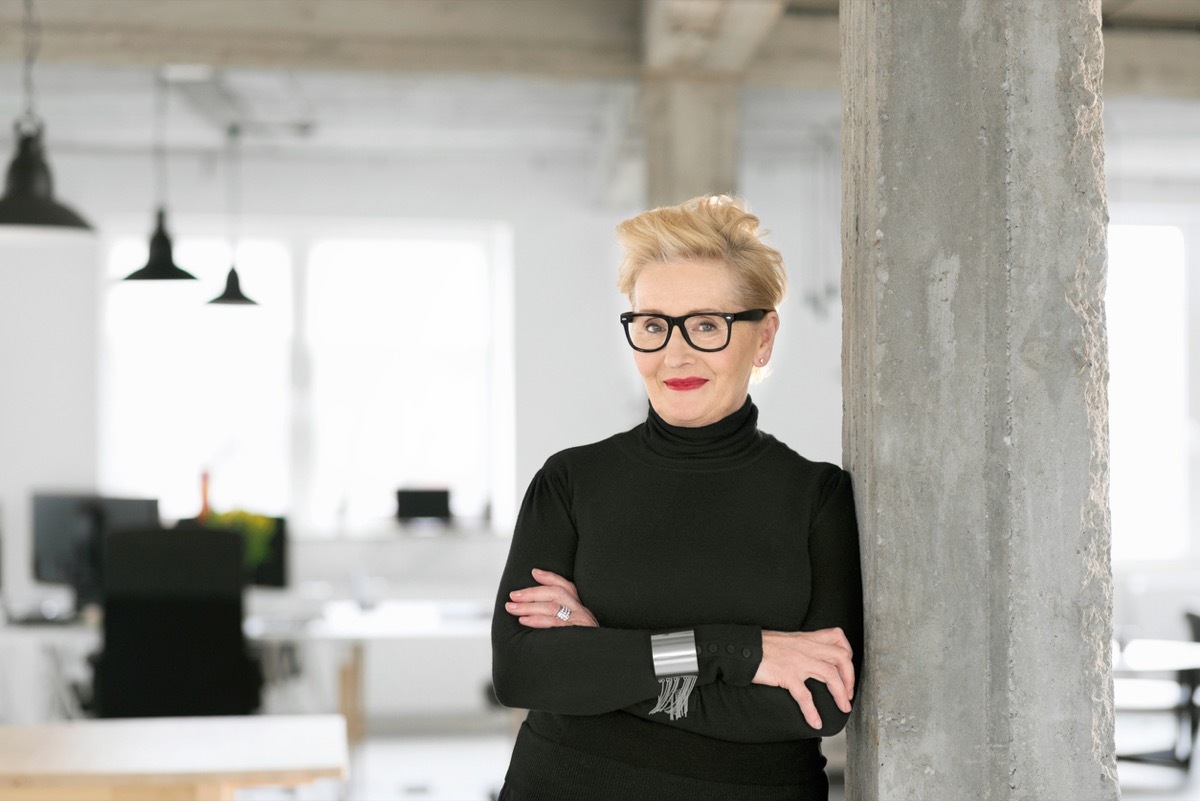 older woman wearing black turtleneck