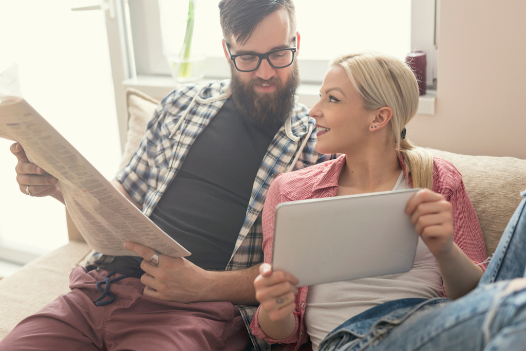 couple reading newspaper