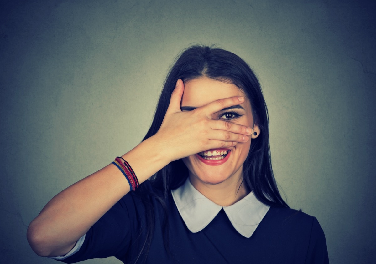 Woman Covering Her Face with Her Hand