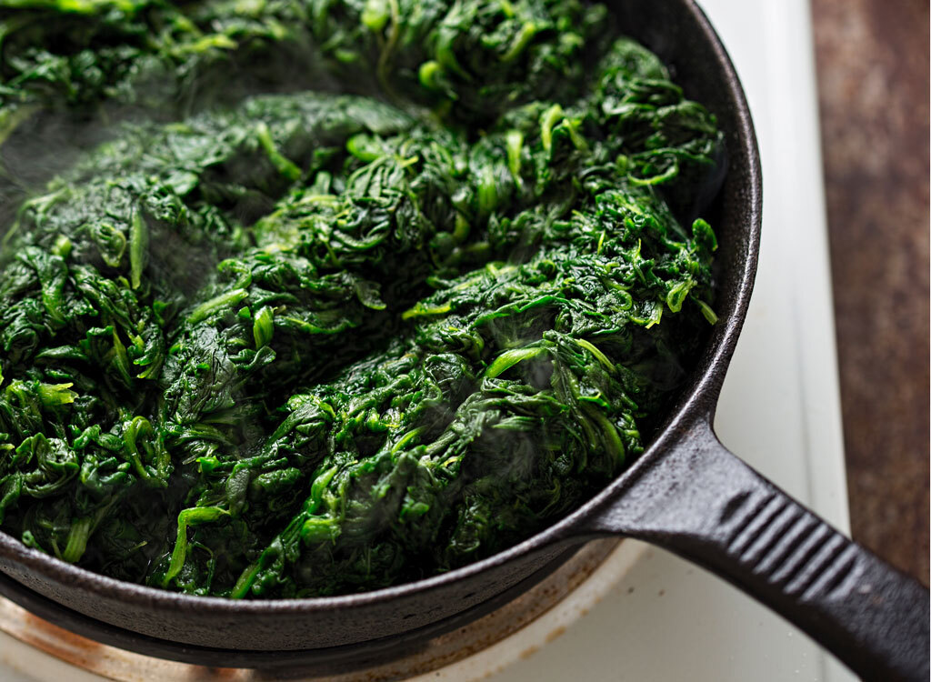 Saute frozen spinach in a cast-iron pan