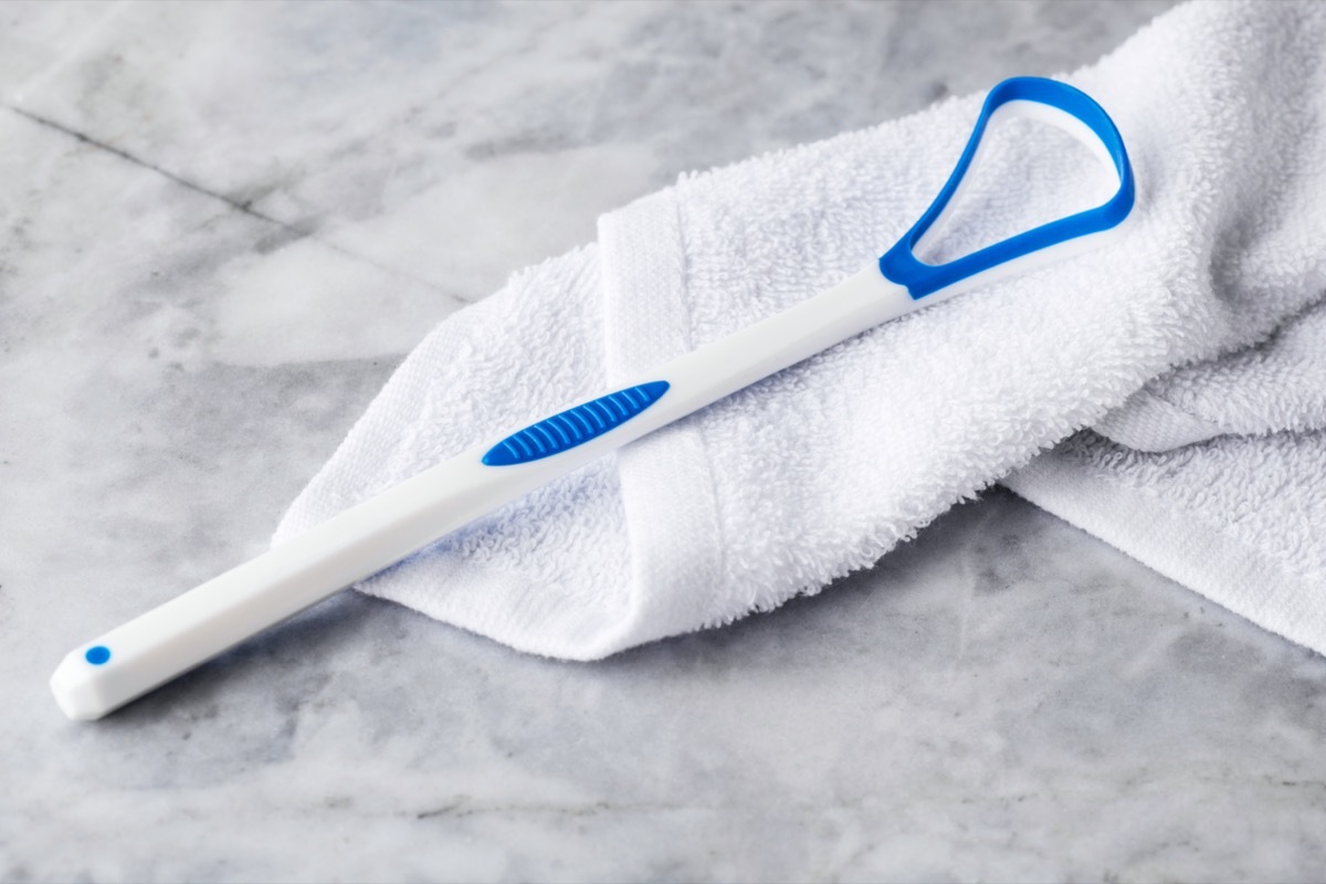 tongue scraper on bathroom counter