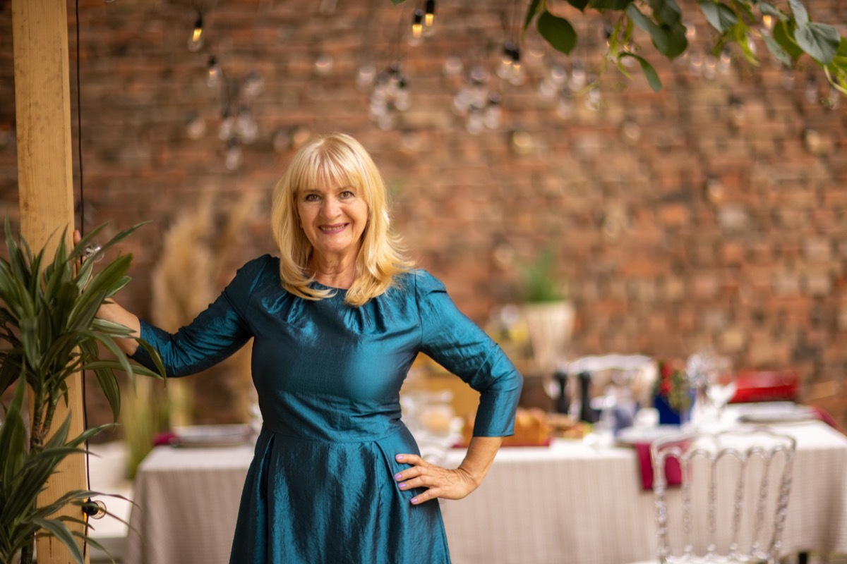 older woman in fit and flare dress