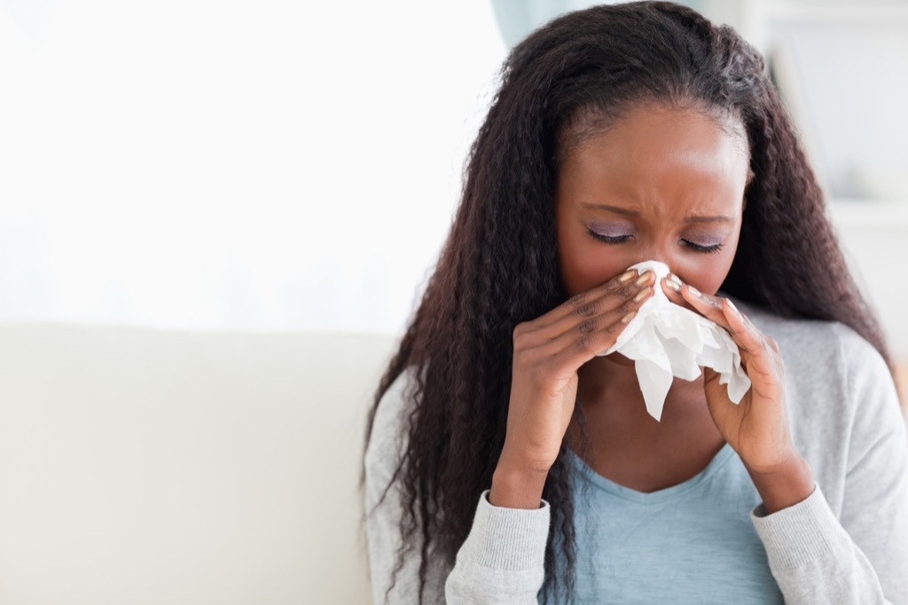 woman blowing her nose