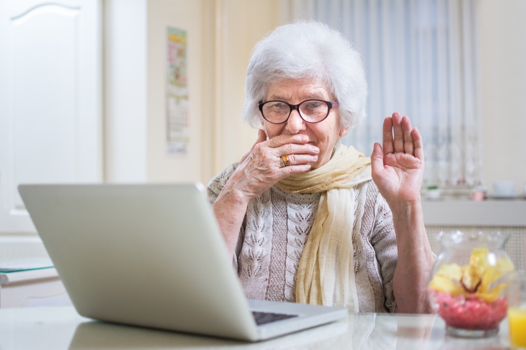 elderly woman laughing at dirty jokes on a laptop, annoying things people do