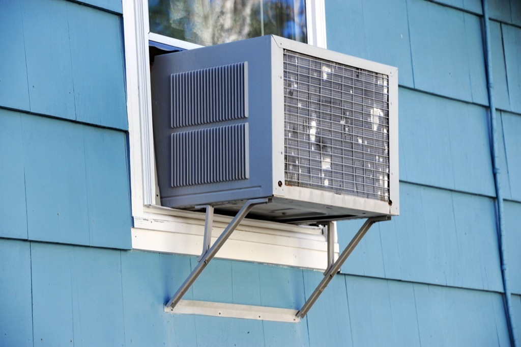 window air conditioner on blue house