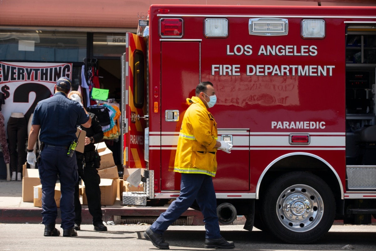 A paramedic returns to their rig after responding to an incident.