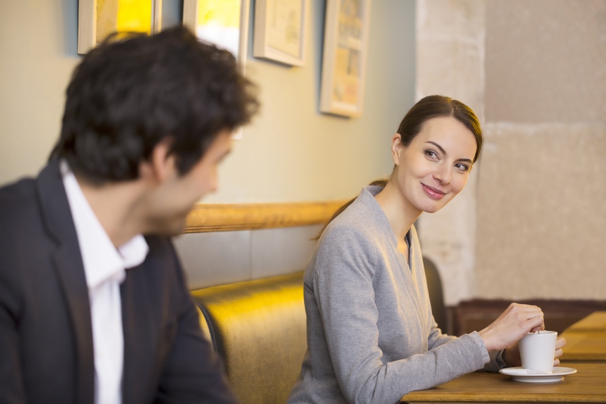 Woman flirting with man using facial expression