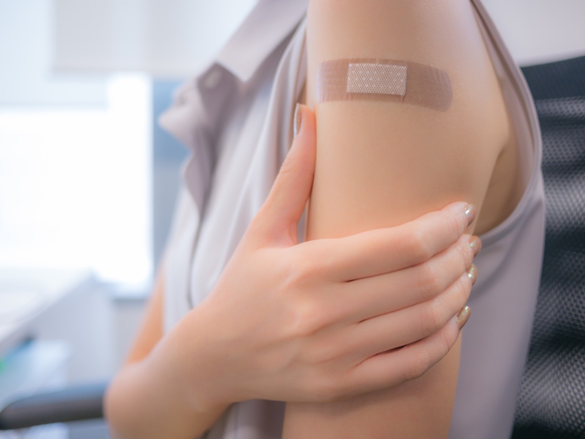 adhesive bandage on a person's arm