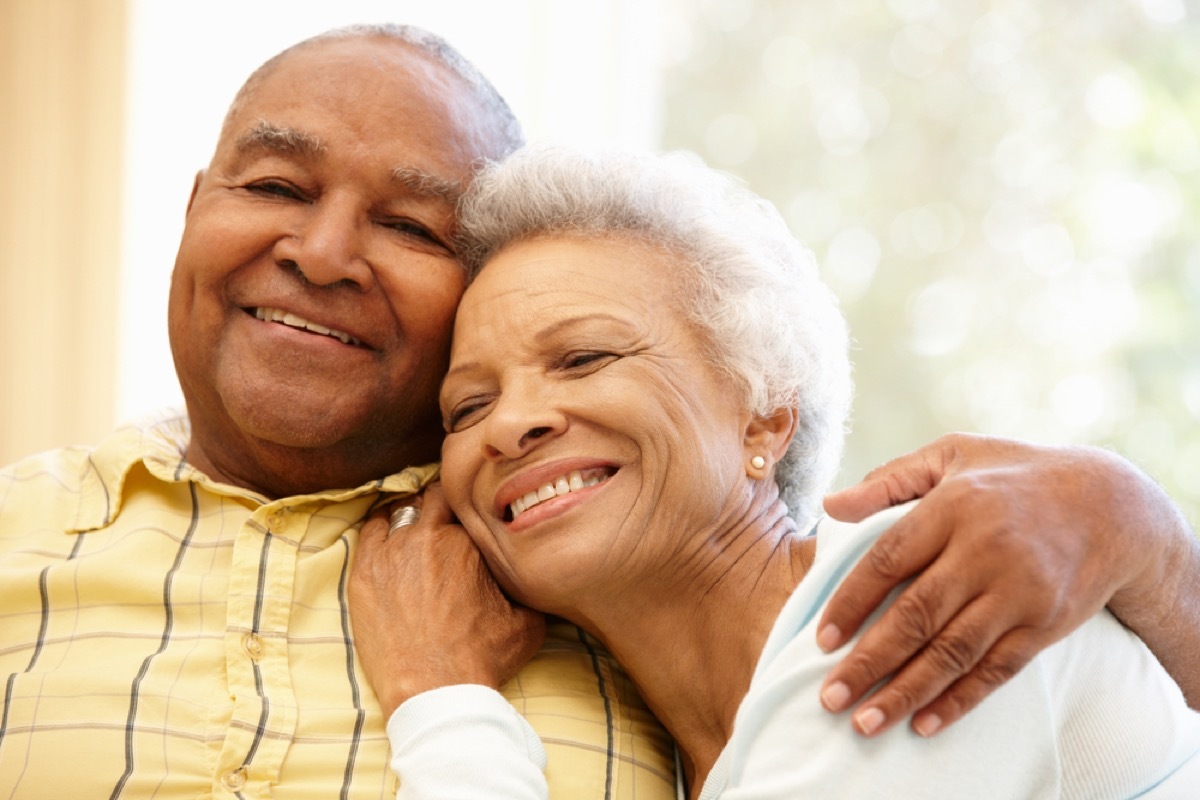 older black couple hugging, healthy sex after 40