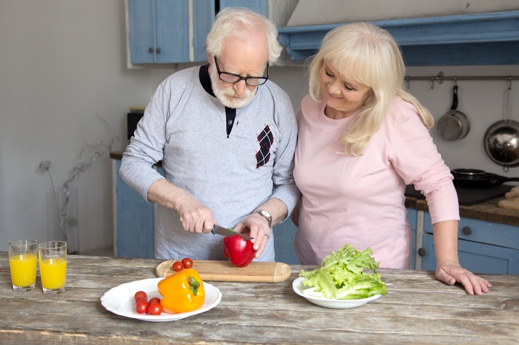 elderly couple cooking a healthy meal, better wife after 40