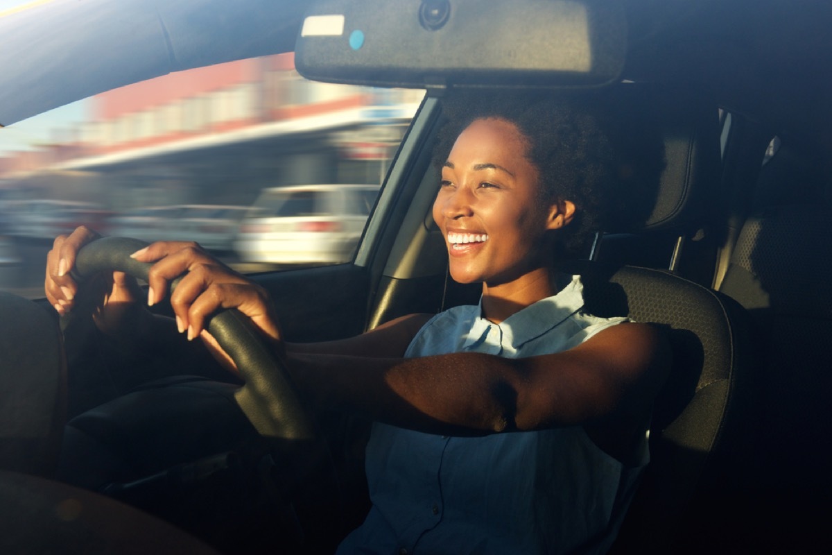 happy woman driving car, working mom