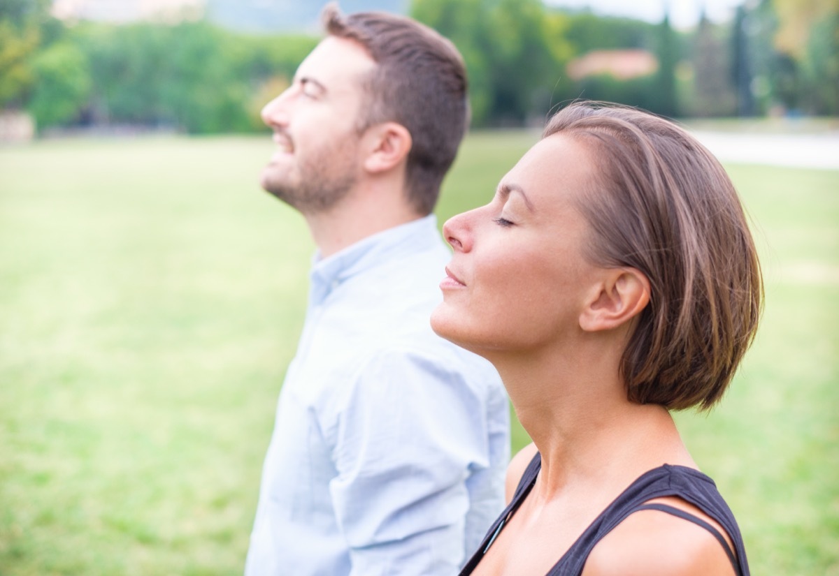 Meditating Adults Taking Deep Breaths exercises for mental health