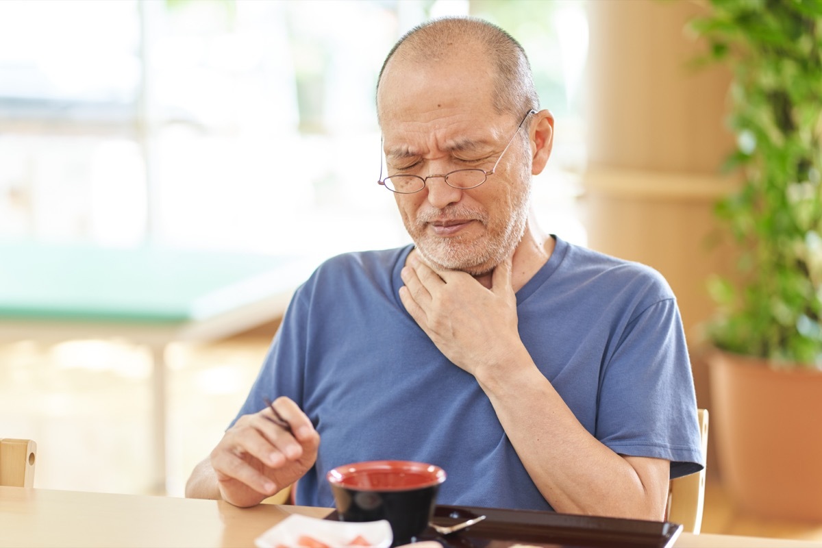 Older Man Having Trouble Swallowing