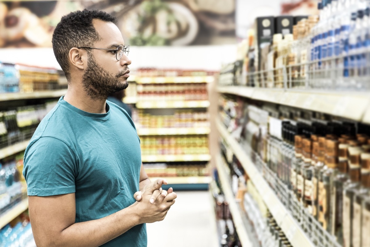 man shopping for alcohol