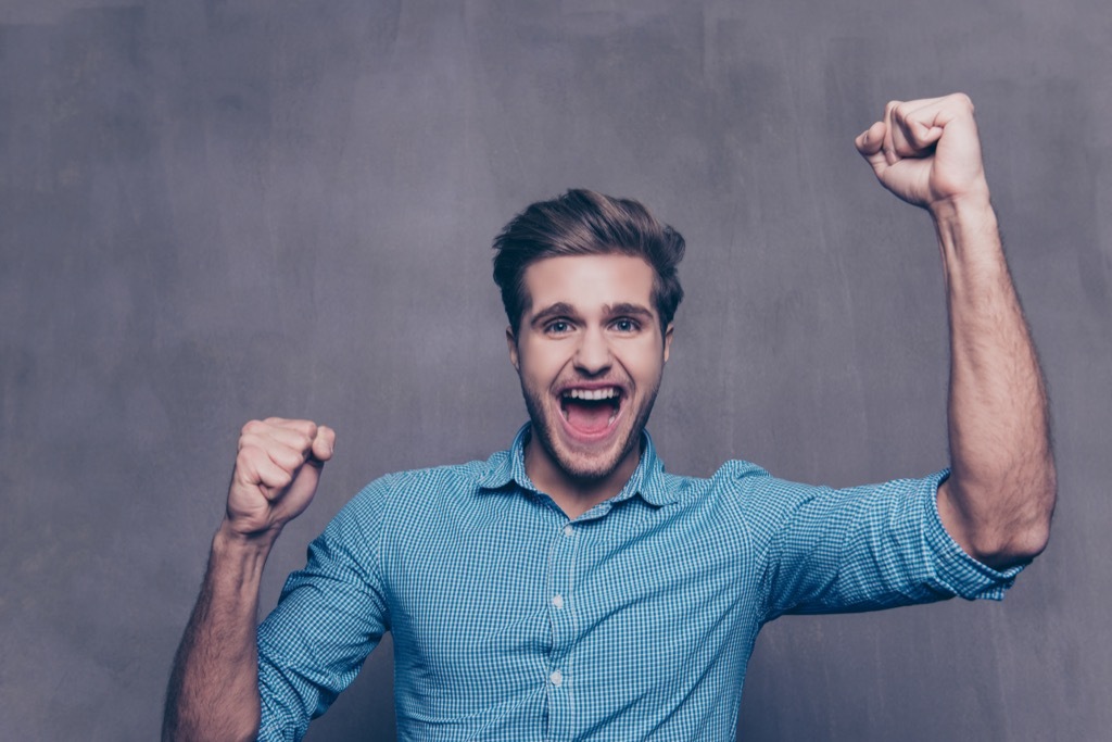 excited guy in a blue shirt