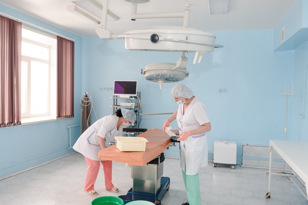 cleaning staff cleaning and sterilizing the operating room after surgery