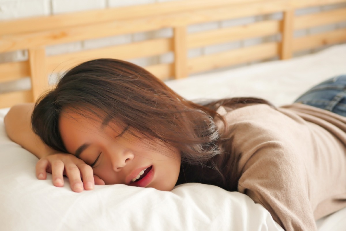 asian woman sleeping with her mouth open, ways you're damaging teeth