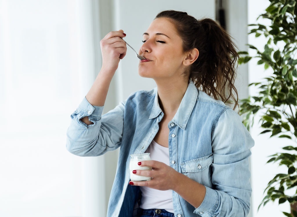 Woman eating yogurt