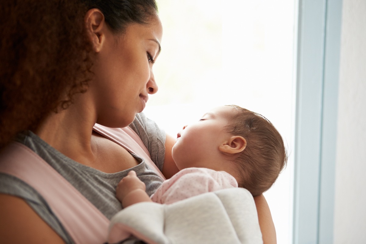 mother holding baby