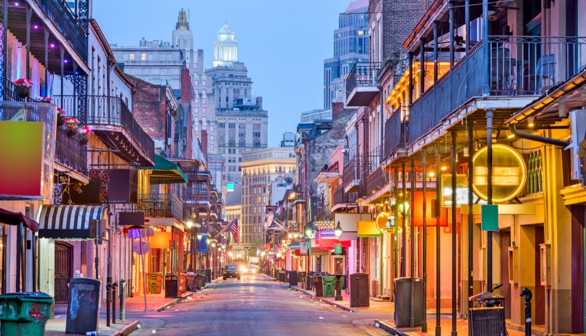 cityscape photos of bars and restaurants on Bourbon Street in New Orleans, Louisiana at twilight