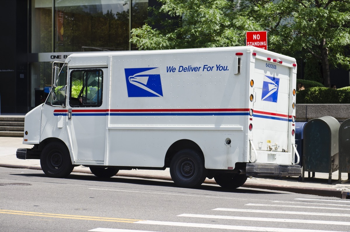 USPS van parked along the Fifth Avenue in New York City. USPS (the United States Postal Service)