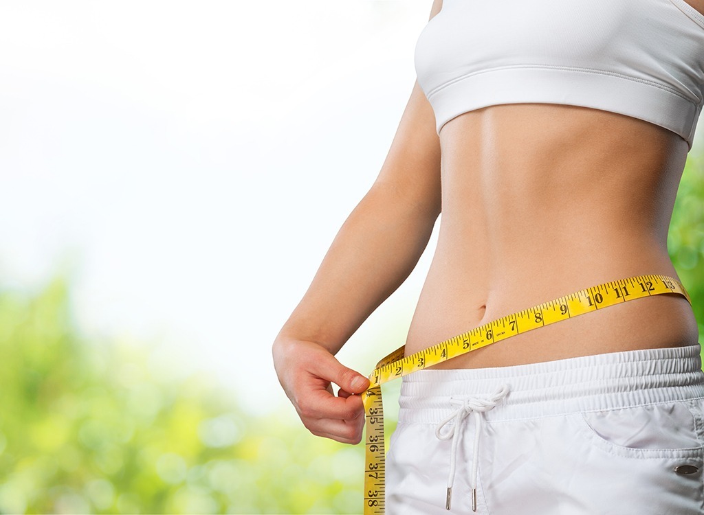 Woman measuring waist