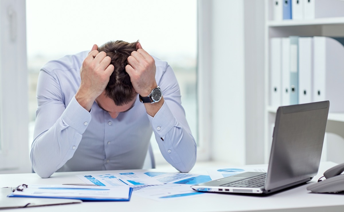 stressed businessman at his desk