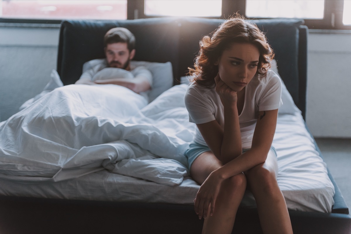 Couple in bed not having sex not talking