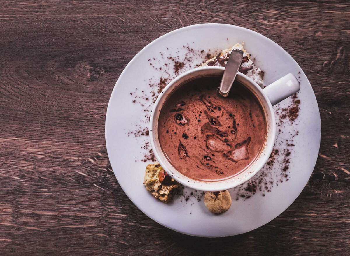 rich hot cocoa powder in mug on white plate