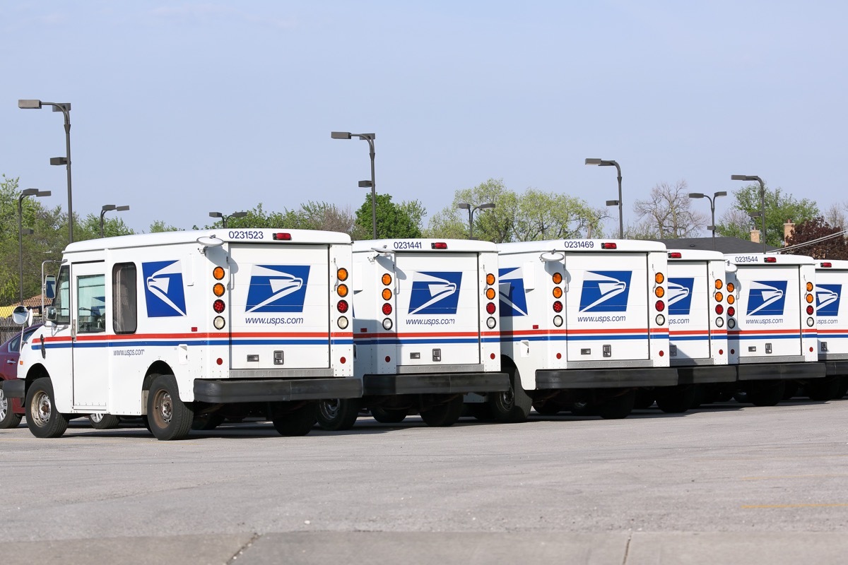 United States Postal Service mail delivery vehicles await deployment in Franklin Park, Illinois.