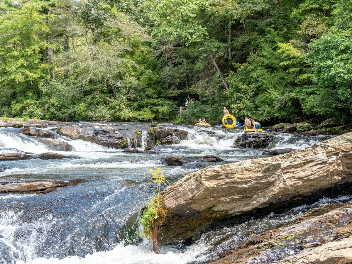 kids go tubing in a river in georgia