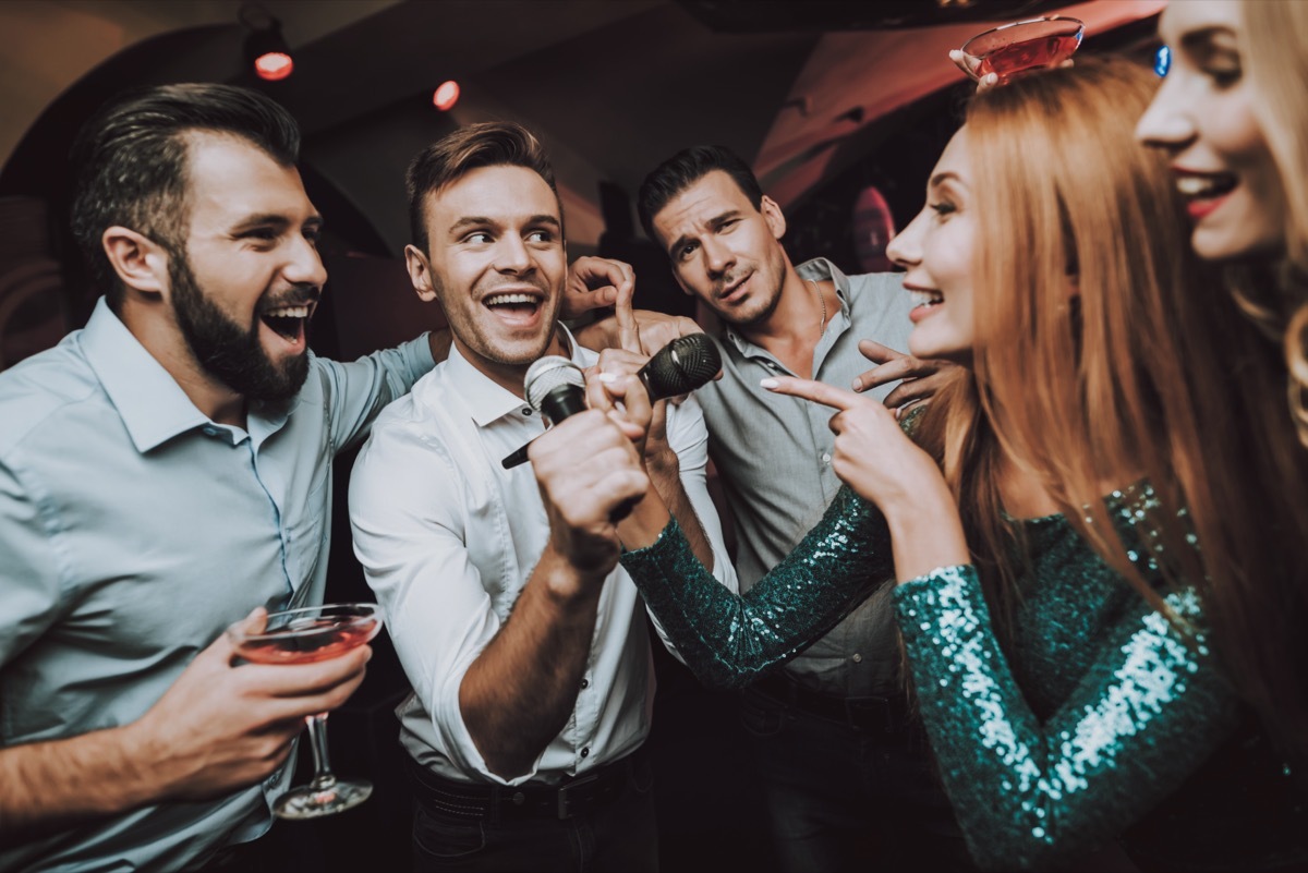 People singing in karaoke bar