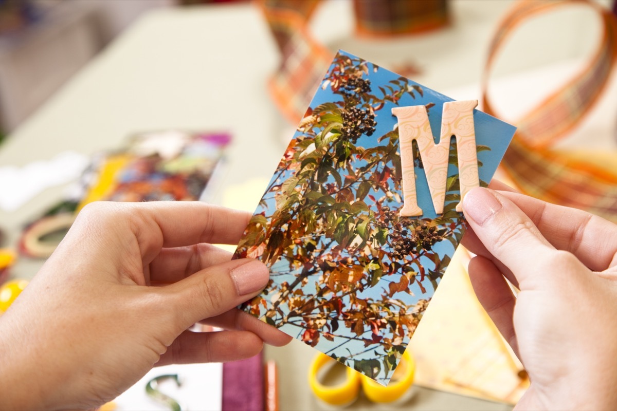 woman making scrapbook