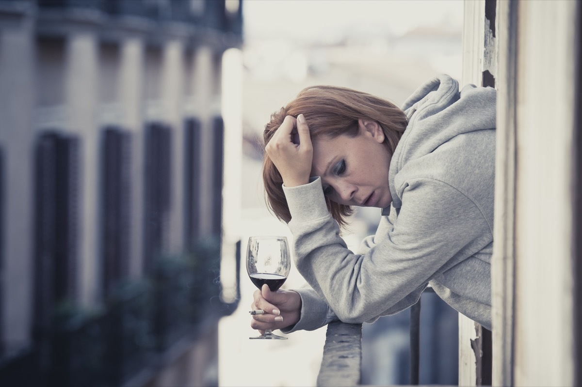 Woman drinking and smoking