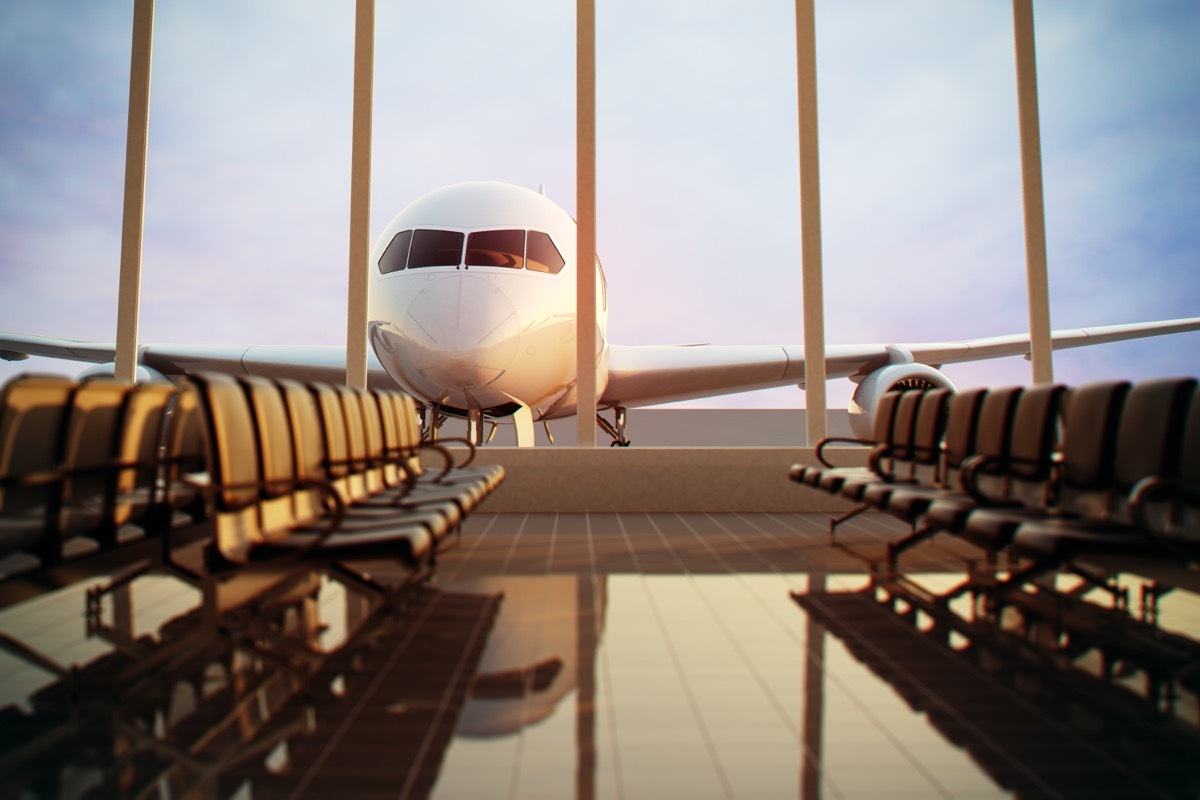 an airplane parked right outside of an airport terminal