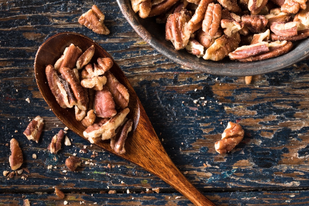 wooden spoon full of pecans