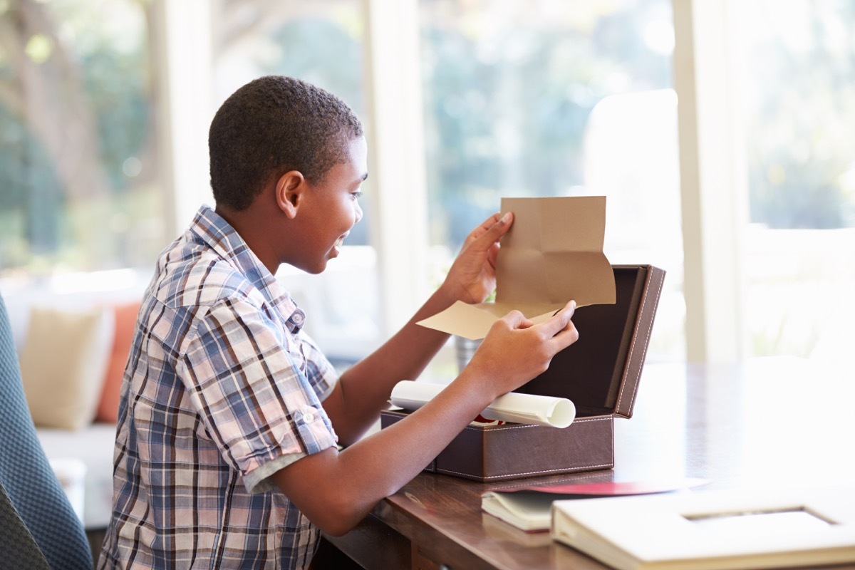 young boy opening memory box