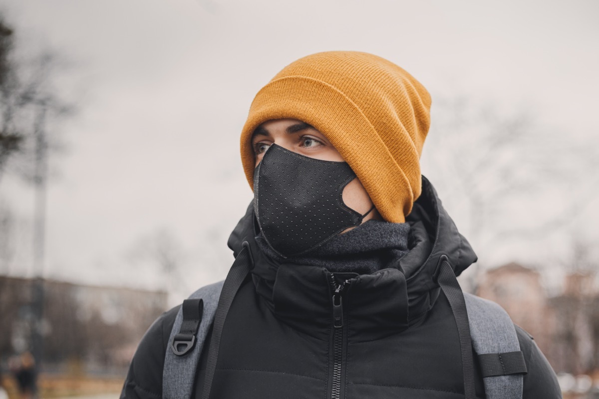 Man in winter hat and face mask