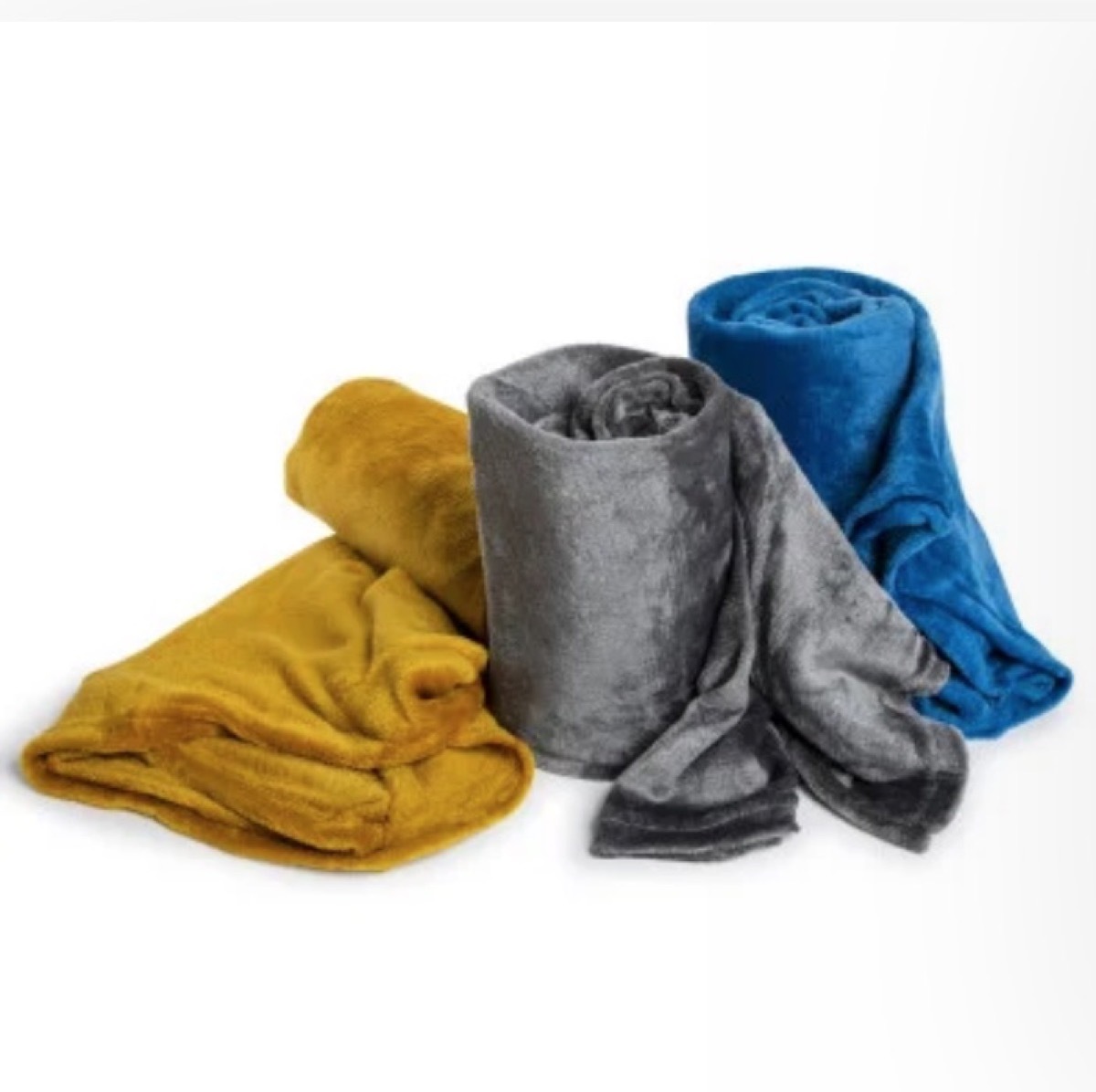 three blankets in yellow, gray, adn blue, dollar store fall decor