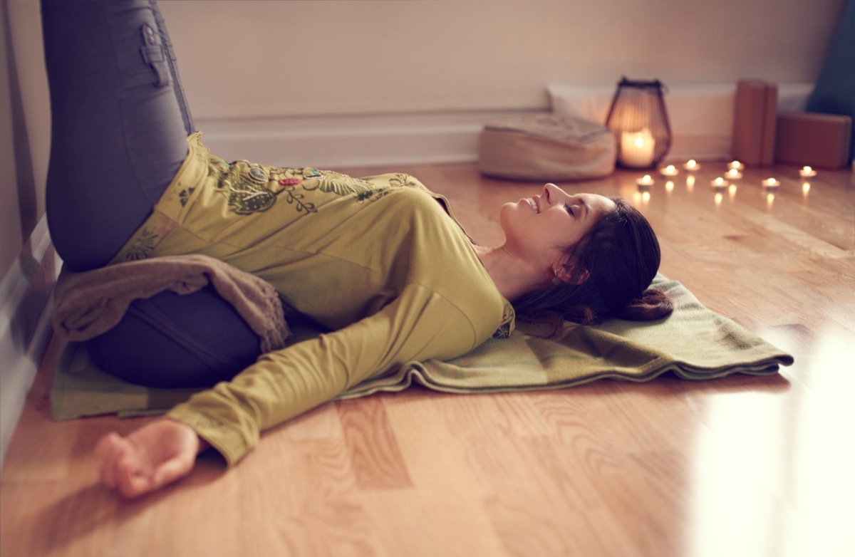 woman doing restorative yoga