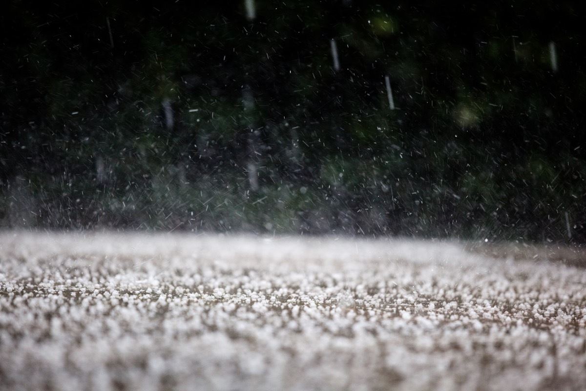 Raining in the neighborhood. Visible rain drops everywhere.