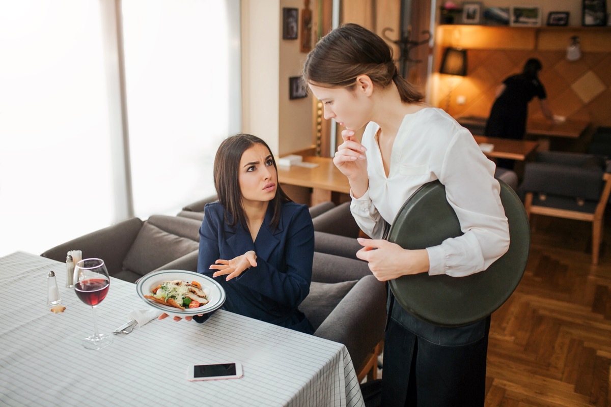 woman yelling at waiter in a restaurant