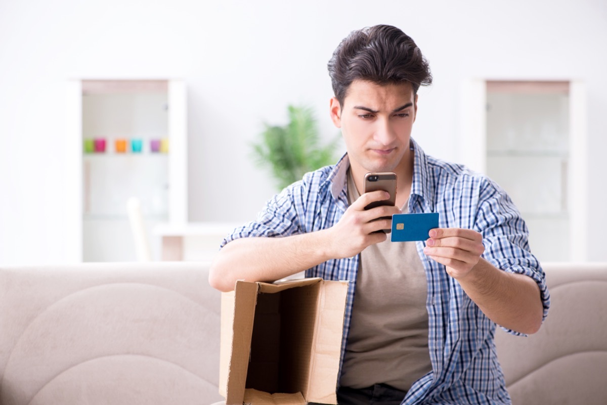 Man taking a picture of his credit card