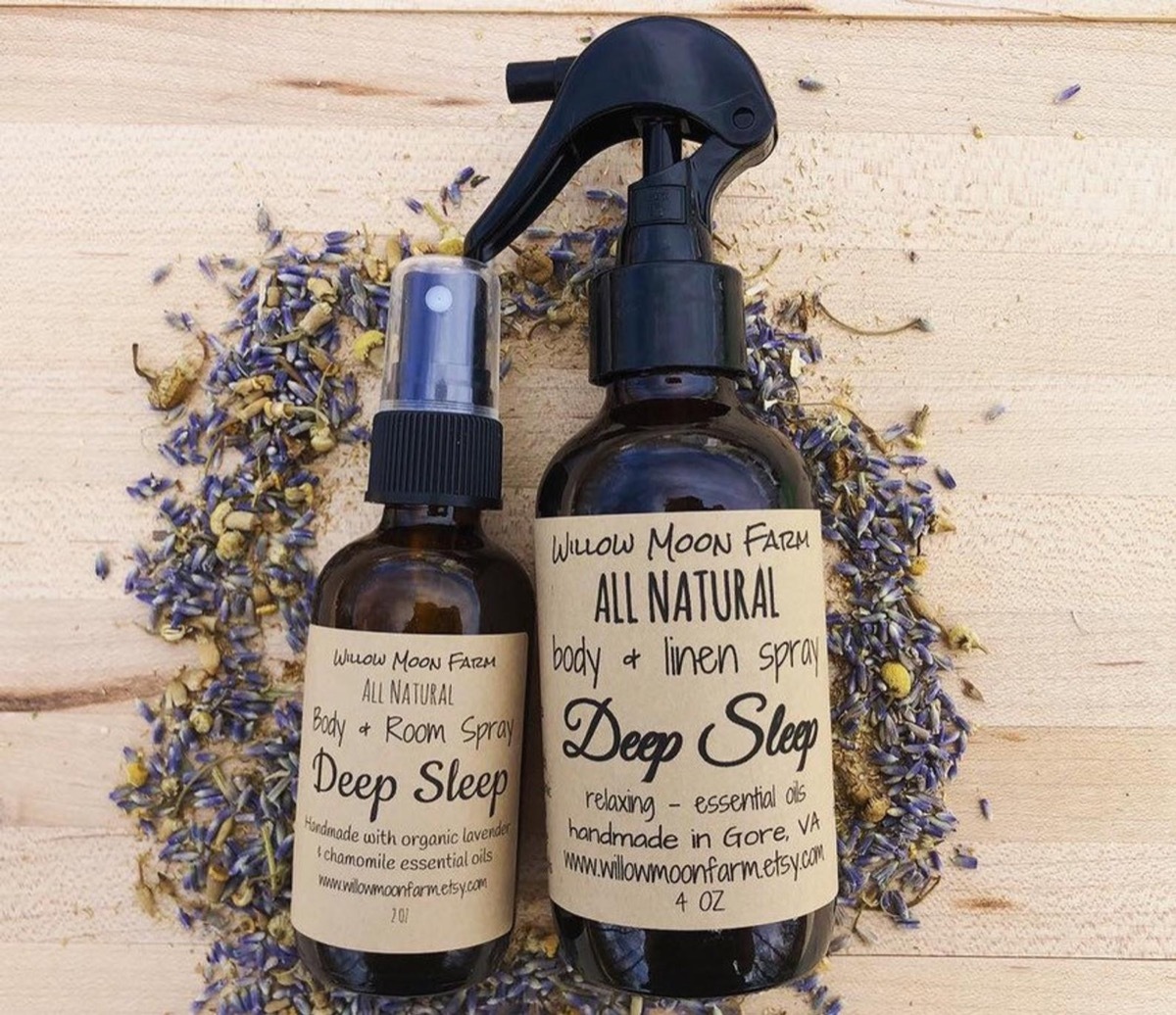 two brown bottles with brown labels on a bed of crushed lavender, better sleep essentials