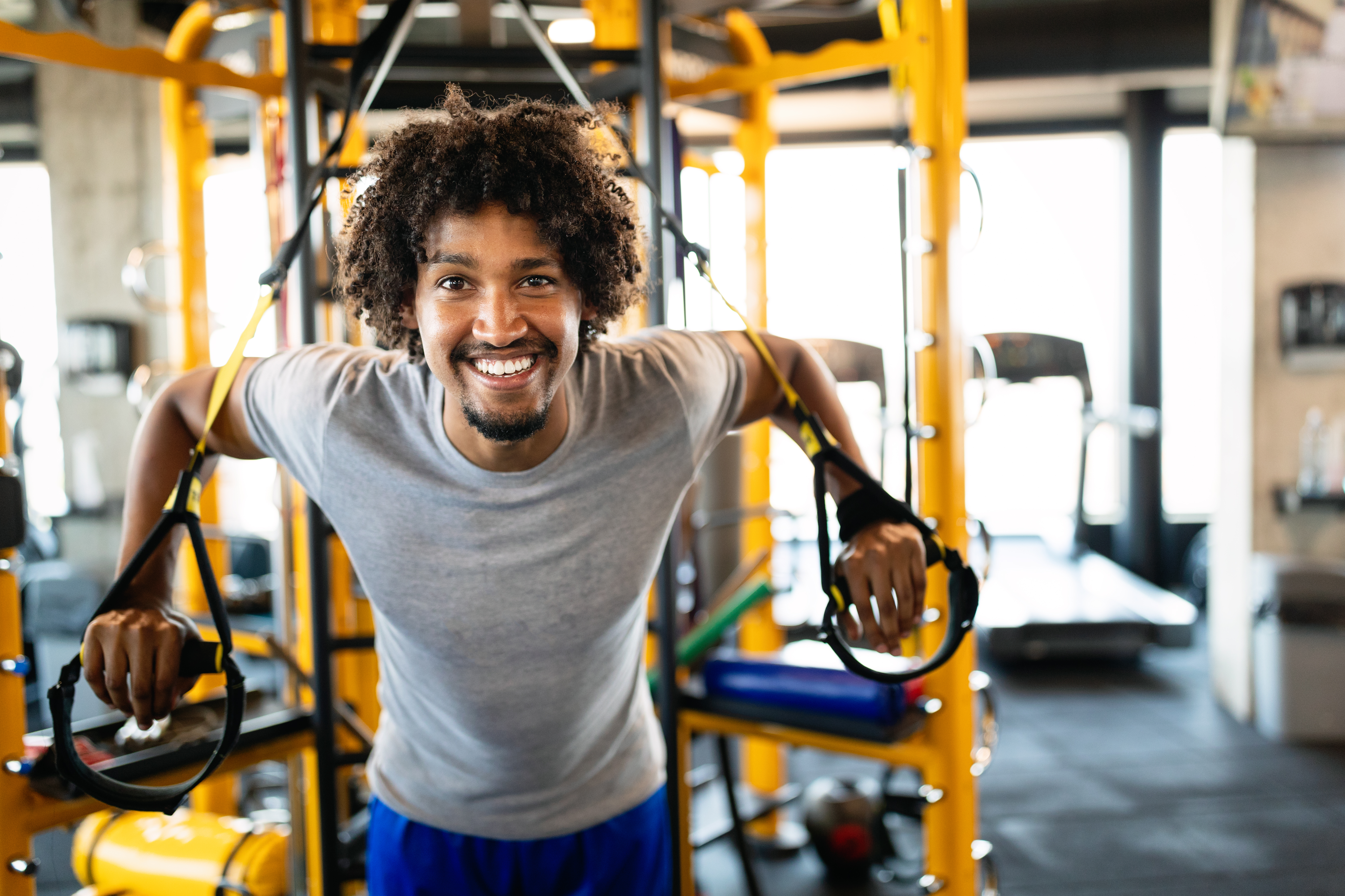 Man using cable machine at gym