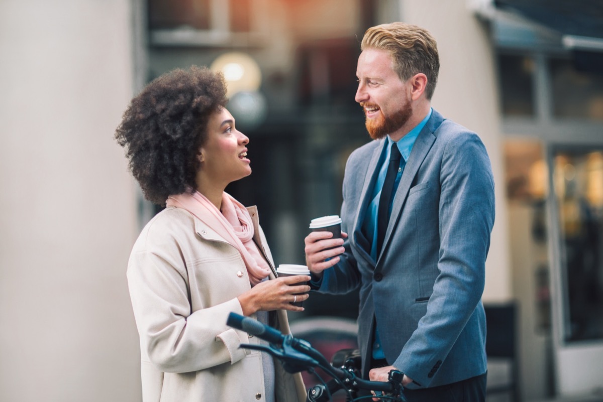 two coworkers talking outside, ways to feel amazing