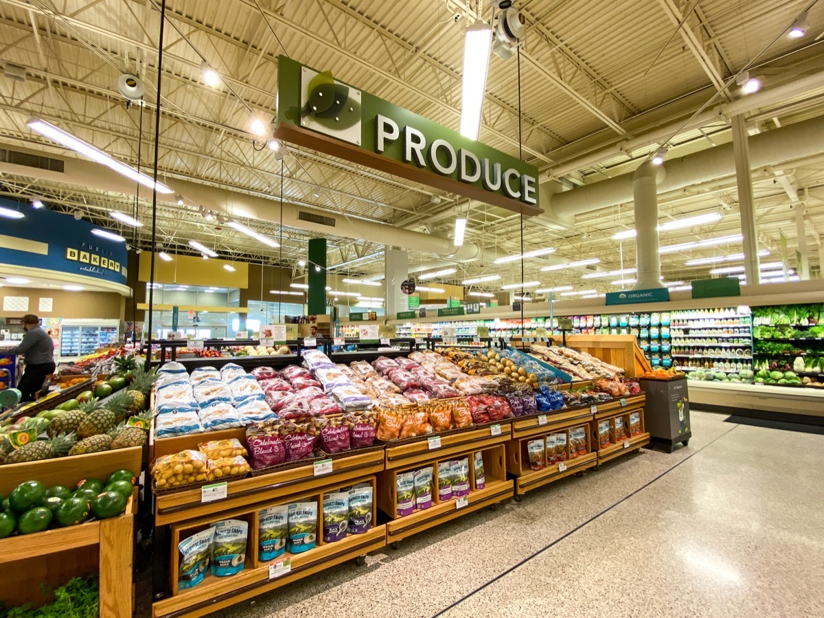 The fresh produce aisle of a grocery store with colorful fresh fruits and vegetables ready to be purchased by consumers.