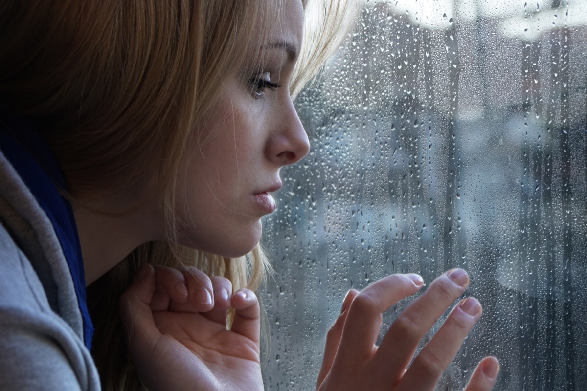 Forlorn Woman Staring out the Window