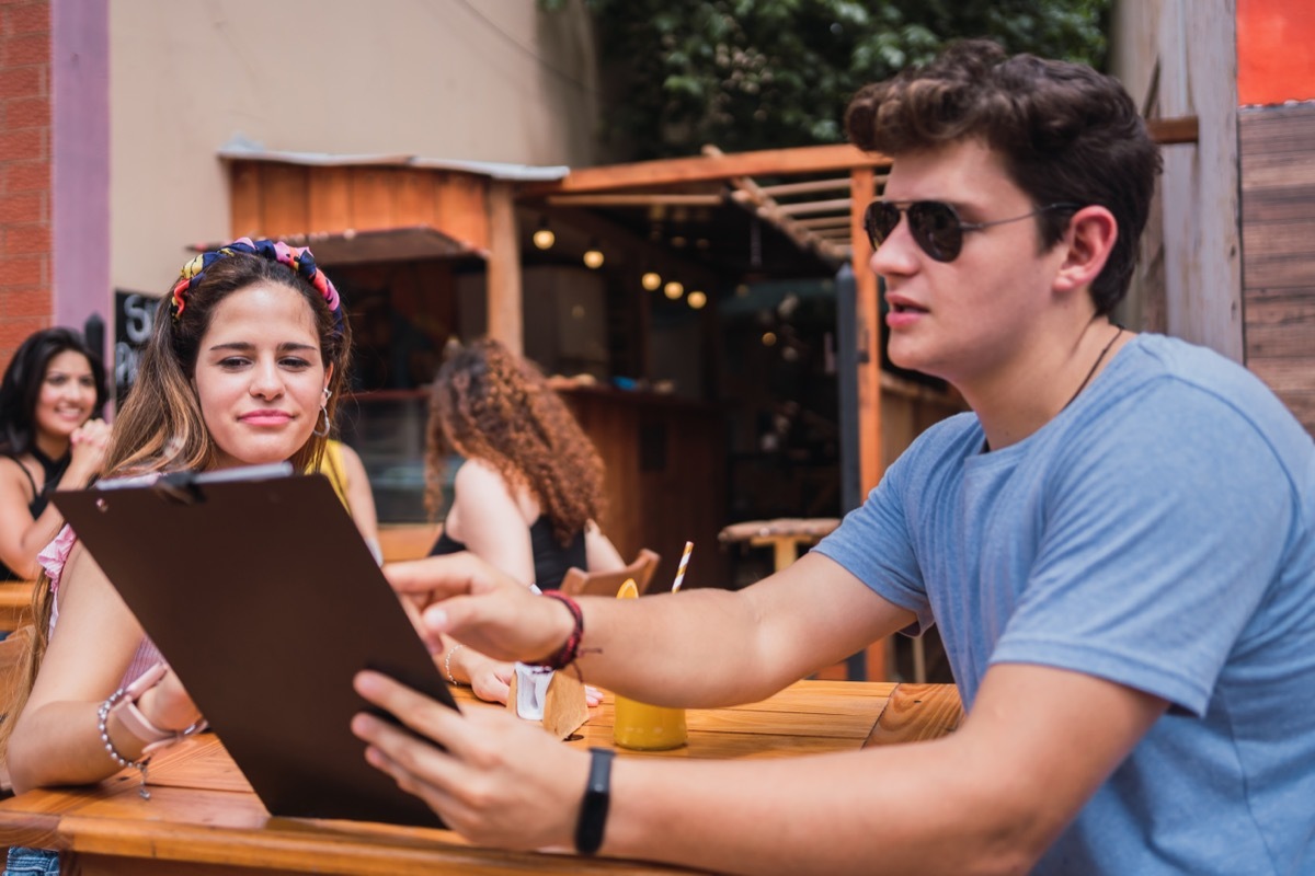 Couple Looking Over a Menu